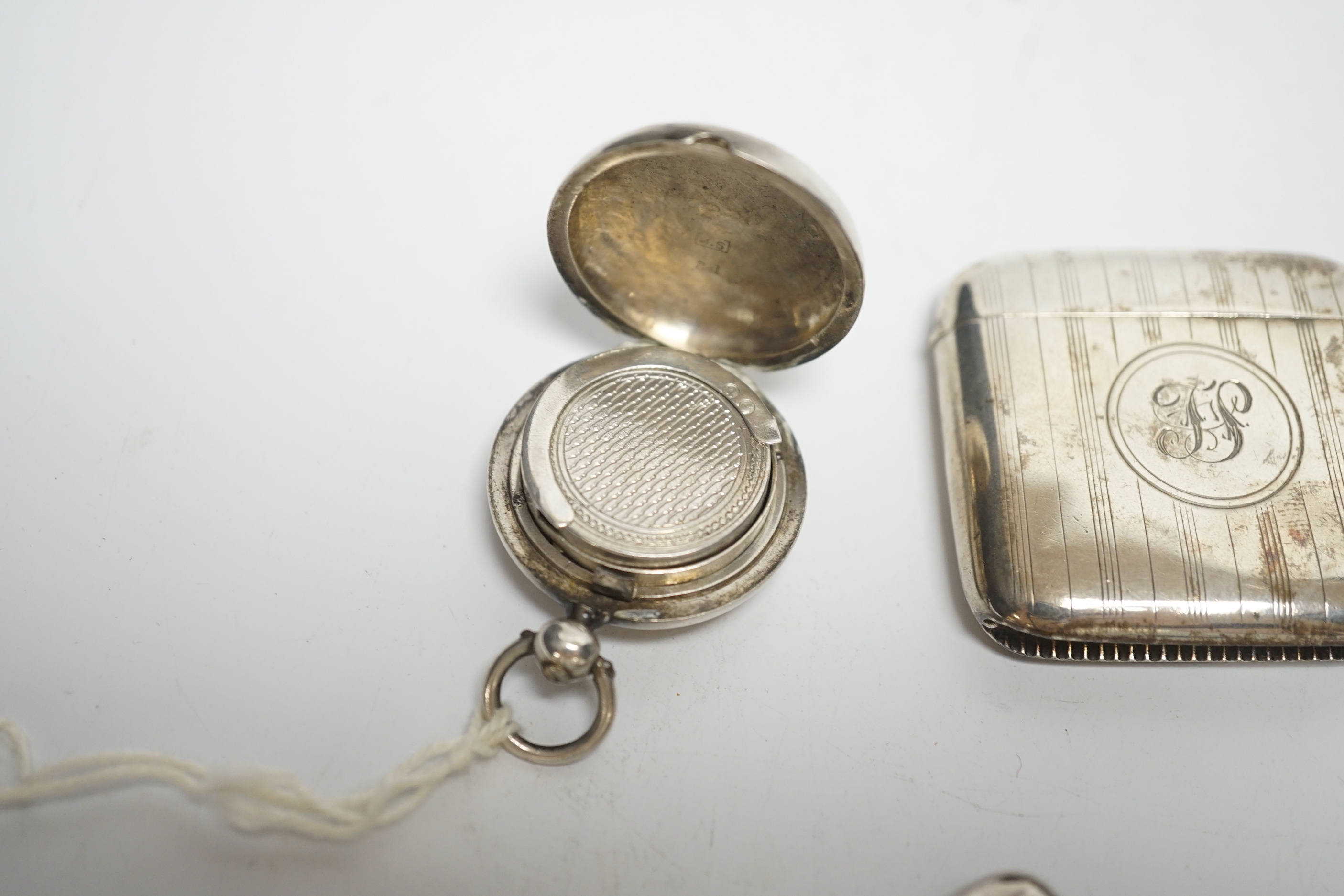 Two late 19th/early 20th century silver sovereign cases, 29mm and two silver vesta cases.